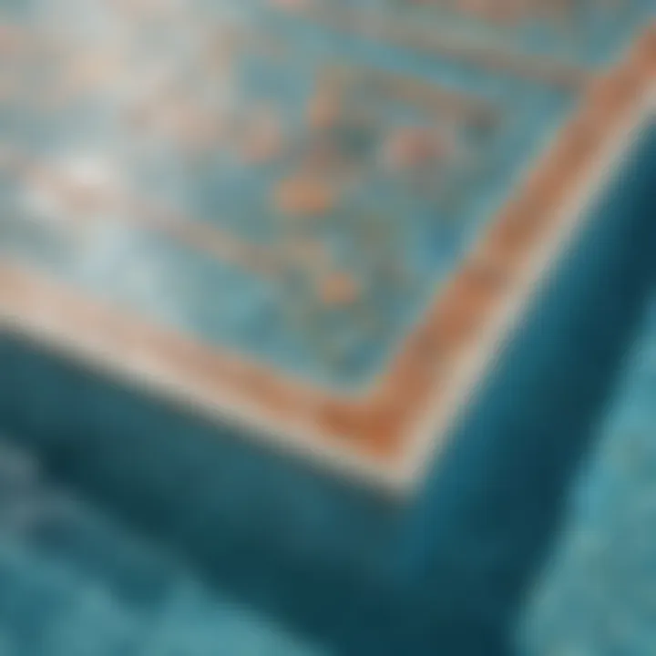 A close-up of intricate tile work around a swimming pool